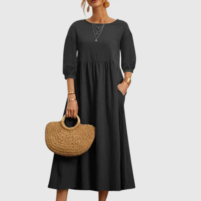 https://cdn.shopify.com/s/files/1/0646/2626/2284/files/Assunta-_L_ssiges_atmungsaktives_Kleid_Grau.webp?v=1740787871