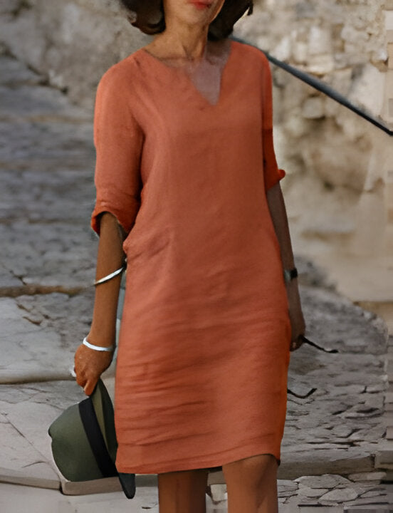https://cdn.shopify.com/s/files/1/0646/2626/2284/files/Yuliana-_Modisches_Sommerkleid_Orange.jpg?v=1740759670