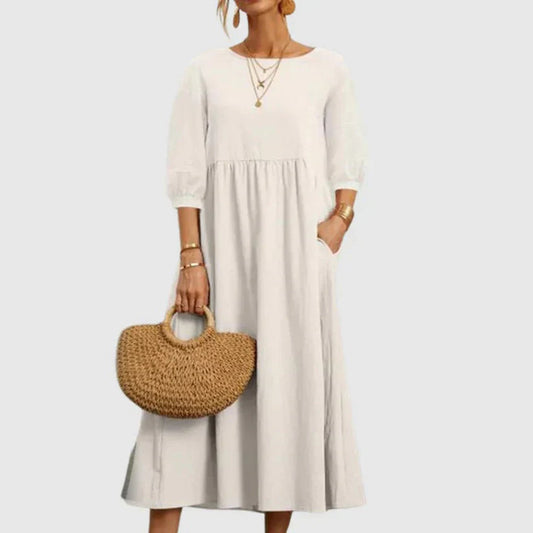 https://cdn.shopify.com/s/files/1/0646/2626/2284/files/Assunta-_L_ssiges_atmungsaktives_Kleid_Wei.webp?v=1740787776