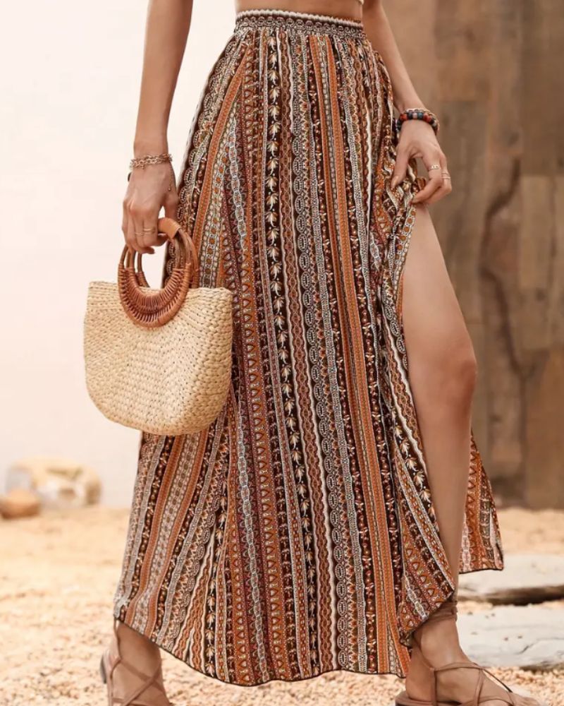 https://cdn.shopify.com/s/files/1/0646/2626/2284/files/Tilia-_Maxirock_mit_Tribal-Print_Kaffee.jpg?v=1740466928