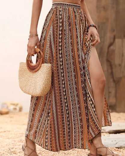 https://cdn.shopify.com/s/files/1/0646/2626/2284/files/Tilia-_Maxirock_mit_Tribal-Print_Kaffee.jpg?v=1740466928