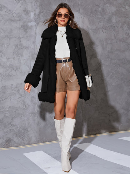 https://cdn.shopify.com/s/files/1/0646/2626/2284/files/Ureka_-_Schicker_Damenmantel_mit_originellem_Design_Schwarz.jpg?v=1738143559